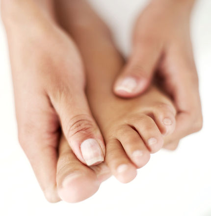 Hands holding foot
