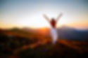 Hiker woman standing with hands up achieving the top. Girl welcomes a sun. Conceptual desi