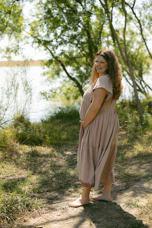 A pregnant mom in a nature setting in San Antonio, the Texas Hill Country. This image represents San Antonio maternity photographer, Lauren Kay's Photography.