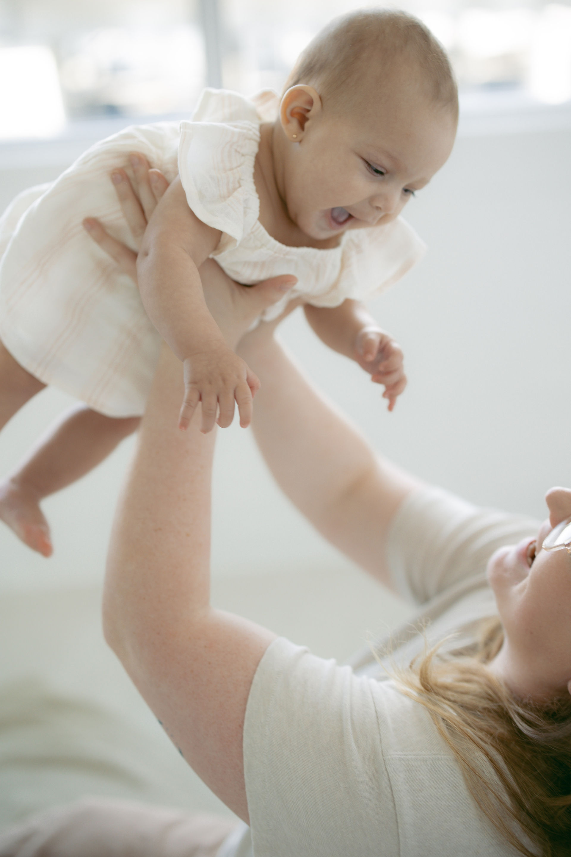 Four generations of women photographed together in a San Antonio studio