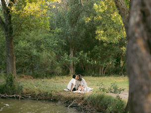 Live Oak Lake milestone photography San Antonio with a family of three beside the water