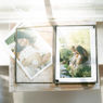 Heirloom family photo album displaying printed family photographs from a San Antonio photography session