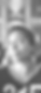 Black and white picture of Jamila Medley. She a Black American woman with a short afro. She is looking up in the photo with a smirk. Her t-shirt is black with cutoff numbers 215. There is an abstract painting in the background
