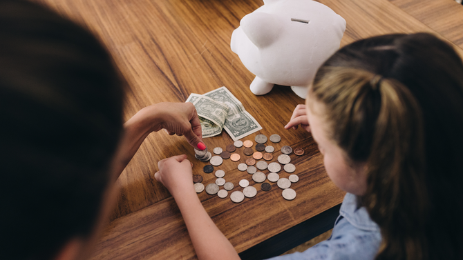 Mom and child counting money