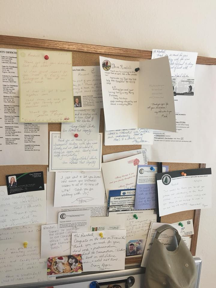 A bulletin board with Thank you cards and testimonials received over the years