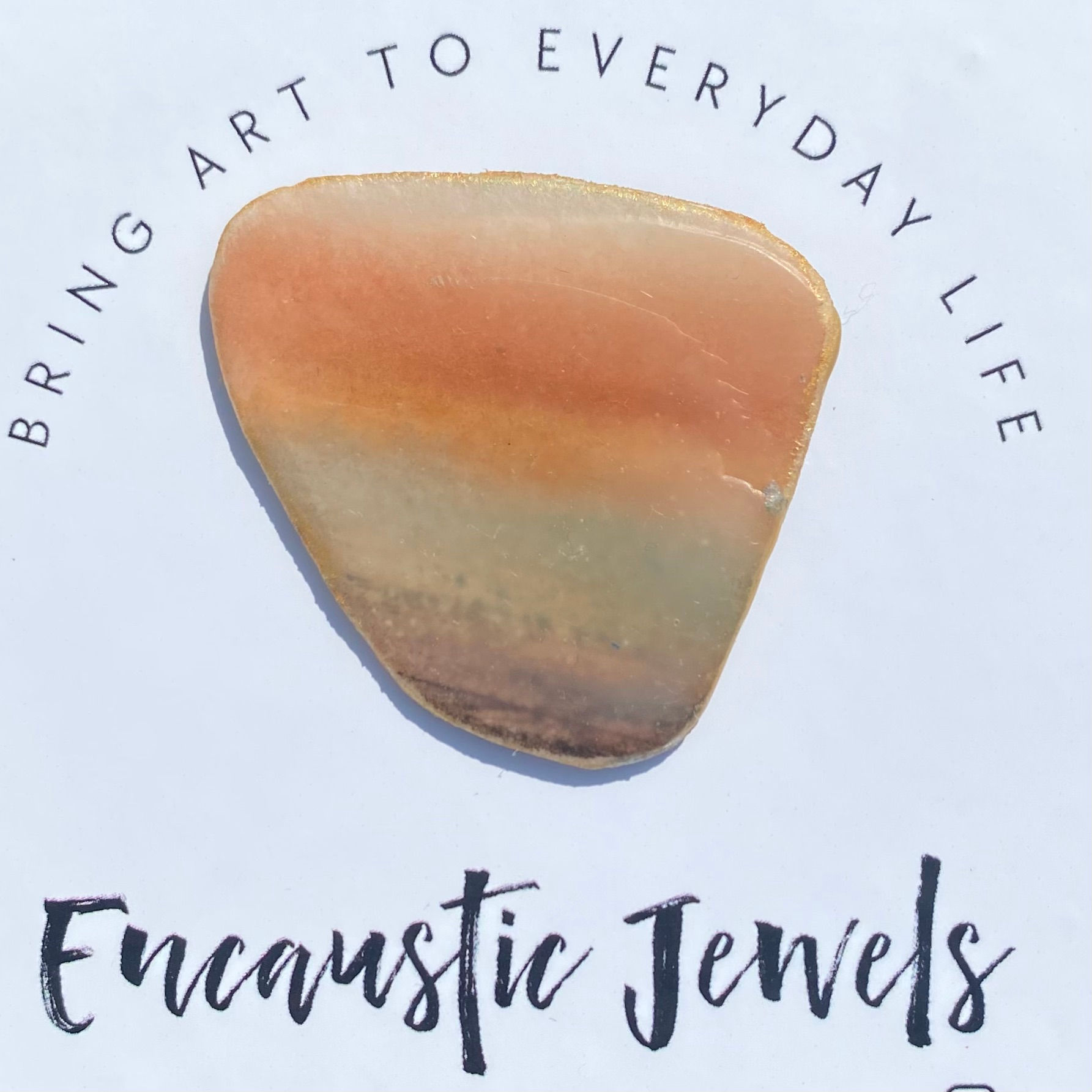 Original artwork coated in encaustic wax to make a wearable art brooch by Worthing artists, Marie Vickers