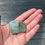 Thumbnail: Original artwork coated in encaustic wax to make a wearable art brooch by Worthing artists, Marie Vickers