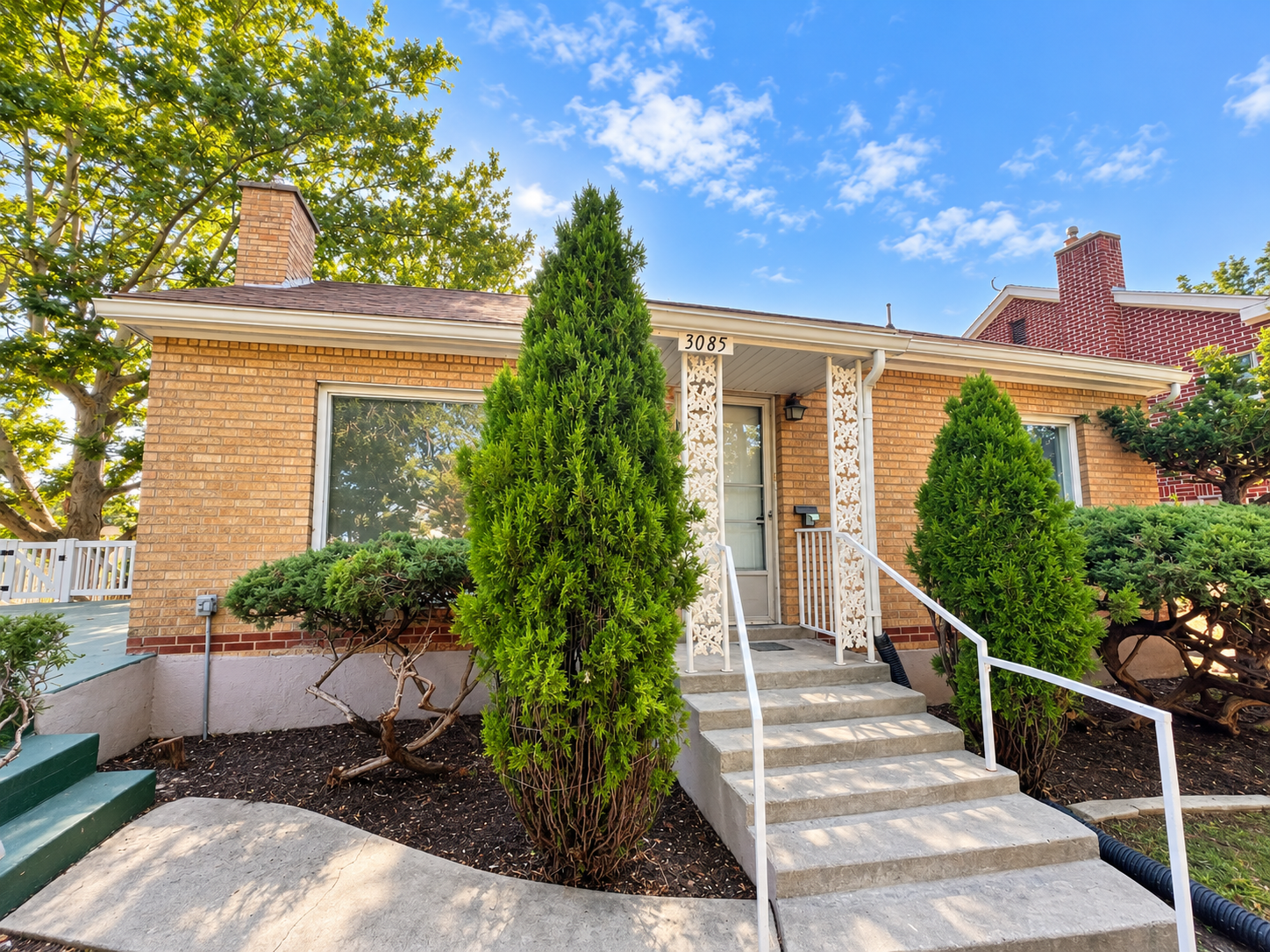 Front exterior of the updated brick home at 3085 Quincy Ave in Ogden, Utah