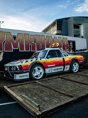 Hoonigan Subaru race car displayed at an automotive event