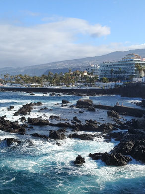 A coastal city with volcanic pools