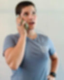 Person talking on their cellphone about conservation and restoration projects in their area.
