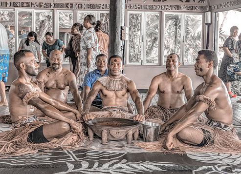 Ritual kava ceremony in Fiji with young and old men preparing the drink. These men are called the warriors - By Nabil El Halwani