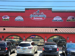 Red exterior of Sawyer’s Farmhouse Breakfast on the Parkway in Pigeon Forge, Tennessee.