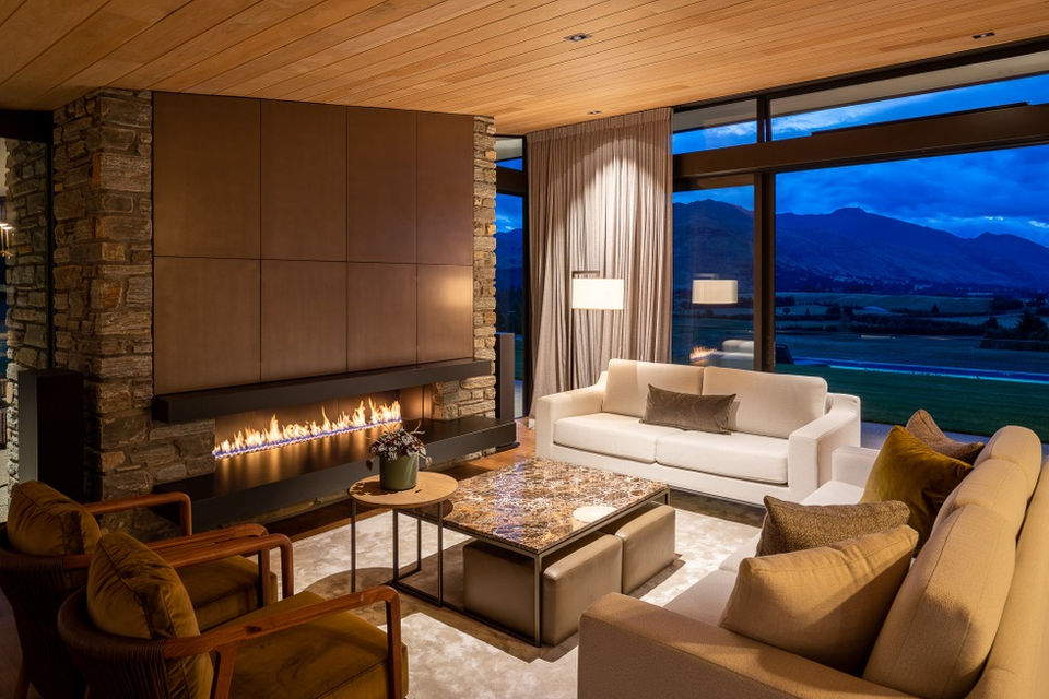 Metalier South Raw Smoky Bronze panels above the fireplace.