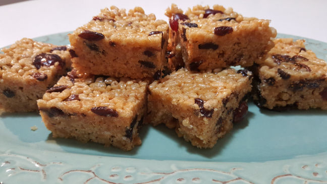 Seven pieces of delectable Honey Rice Bubble Slice arranged beautifully on a plate.