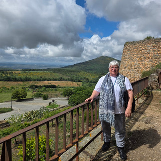 Louise overlooking the hills and village walls of Castelo Rodrigo, a peaceful stop in her Hidden Gems of Portugal travel story.