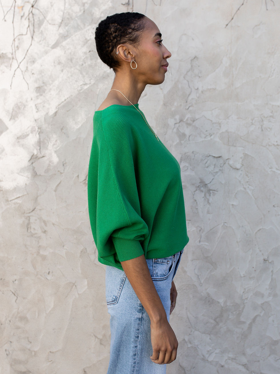 Thumbnail: green sweater side view
