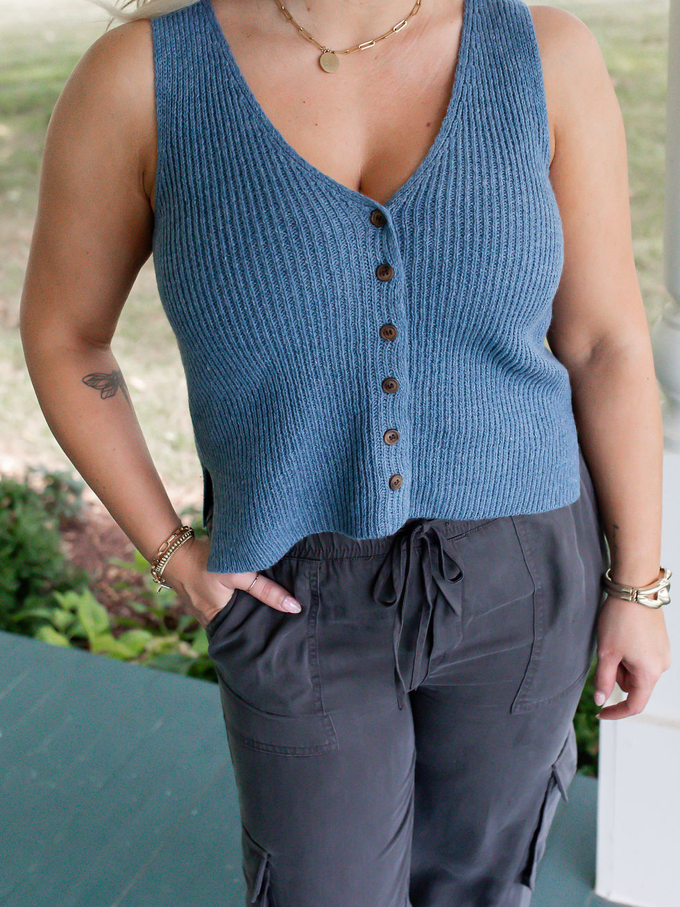 blue sweater vest detail view