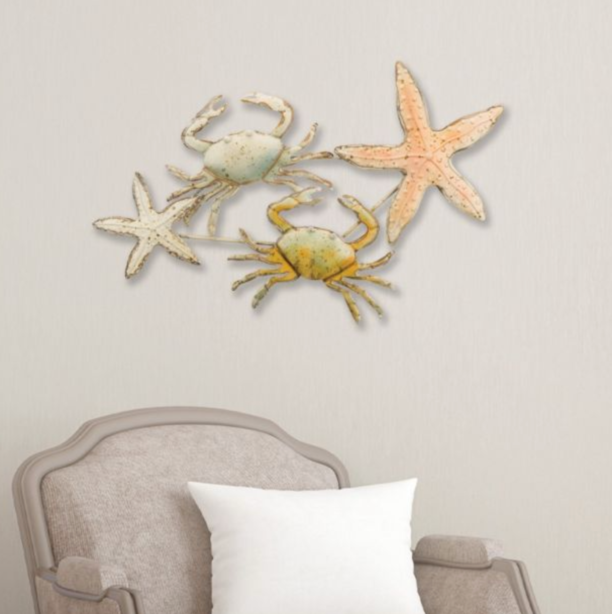 Two crabs and two starfish warm pastel toned wall art above a chair