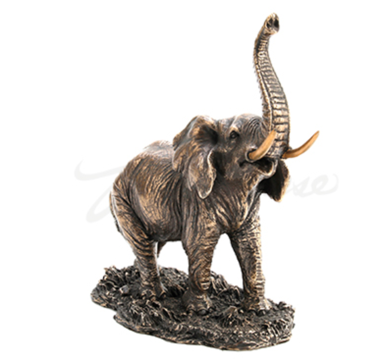 Thumbnail: Metal elephant sculpture standing on foliage with upraised trunk