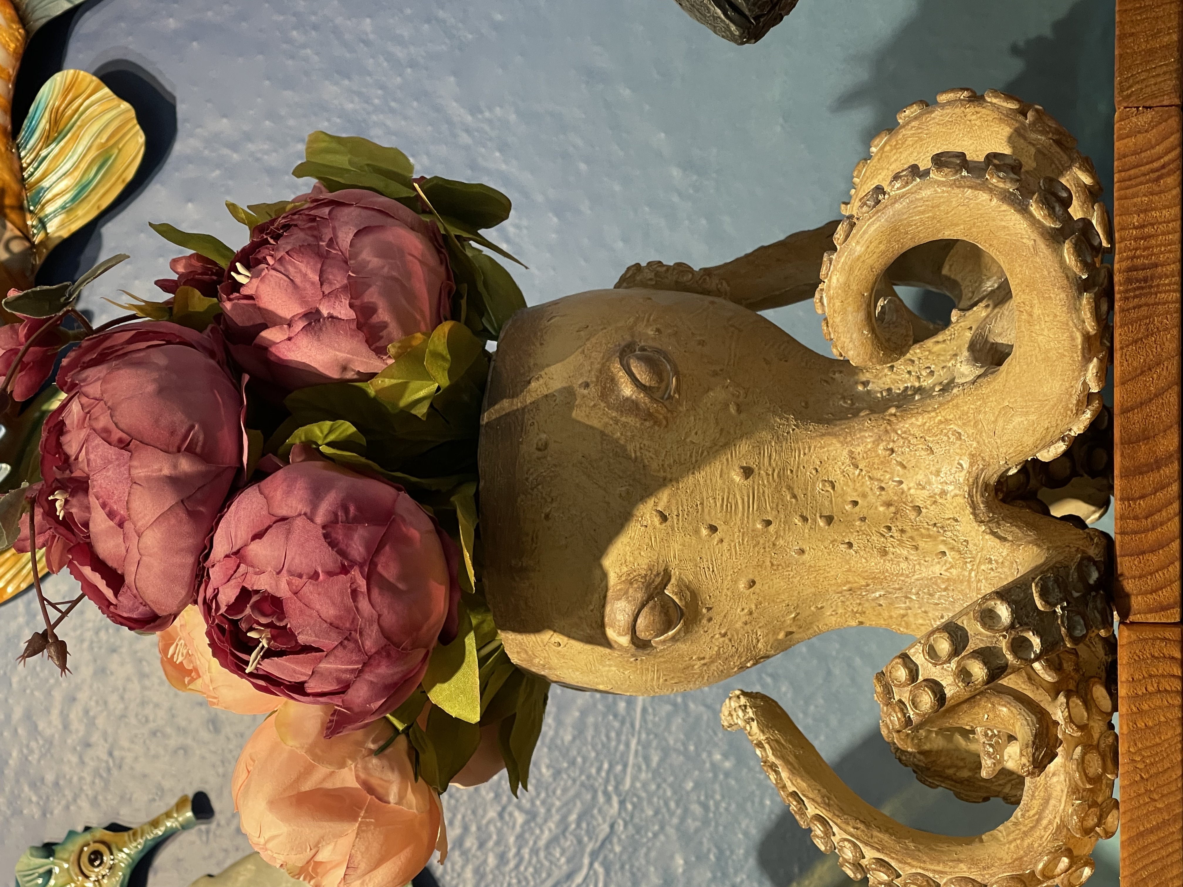 Whimsical octopus vase holding flowers