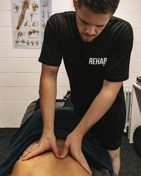 man physio back massage.jpeg