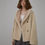 Thumbnail: Woman wearing Bella Poetry Reversible Artificial Compound Leather Shearling Short Jacket, beige coat.