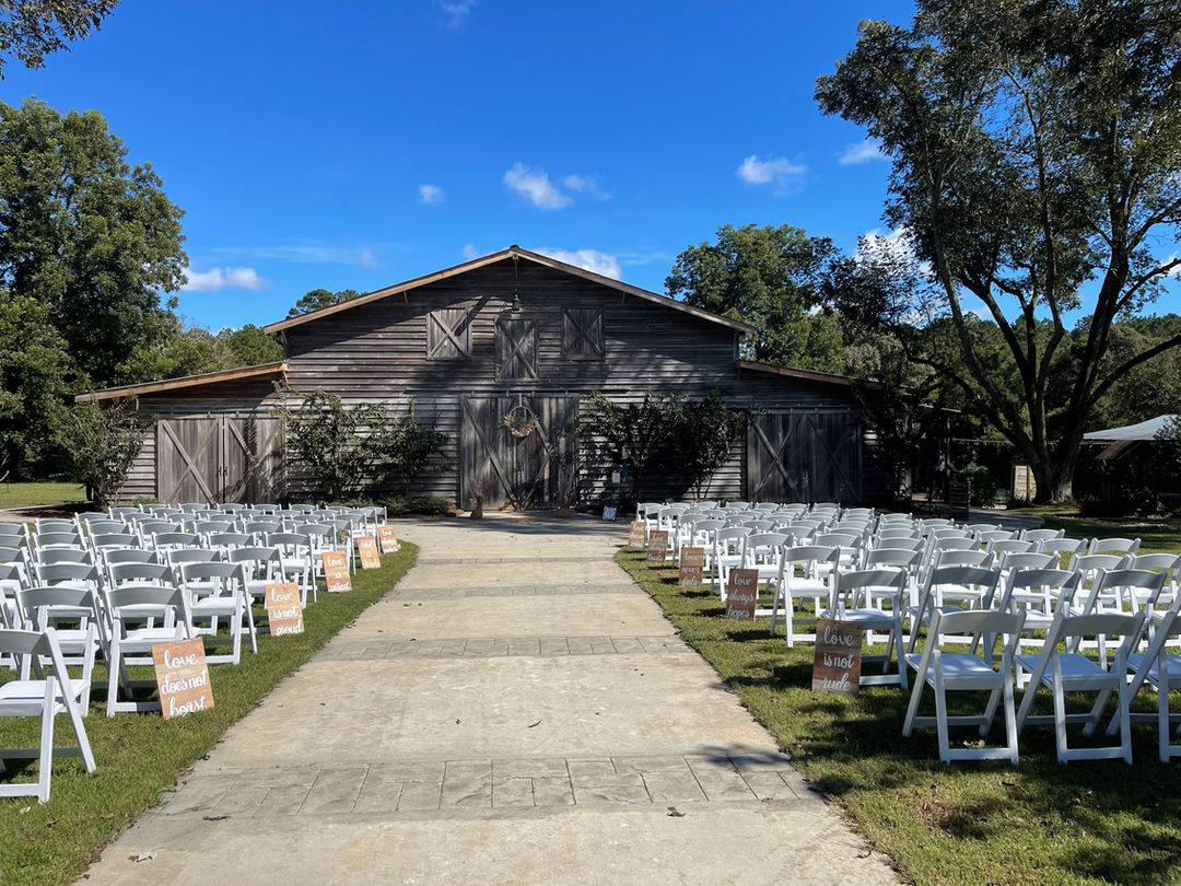 The Wedding Barn at L'Horne venue in middle Georgia featuring our walkway ceremony site facing the grand barn