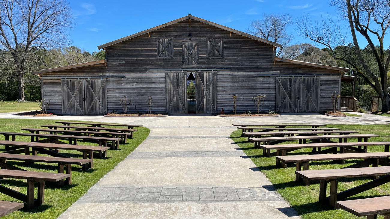 The Wedding Barn at L'Horne venue in middle Georgia featuring our walkway with pews for seating