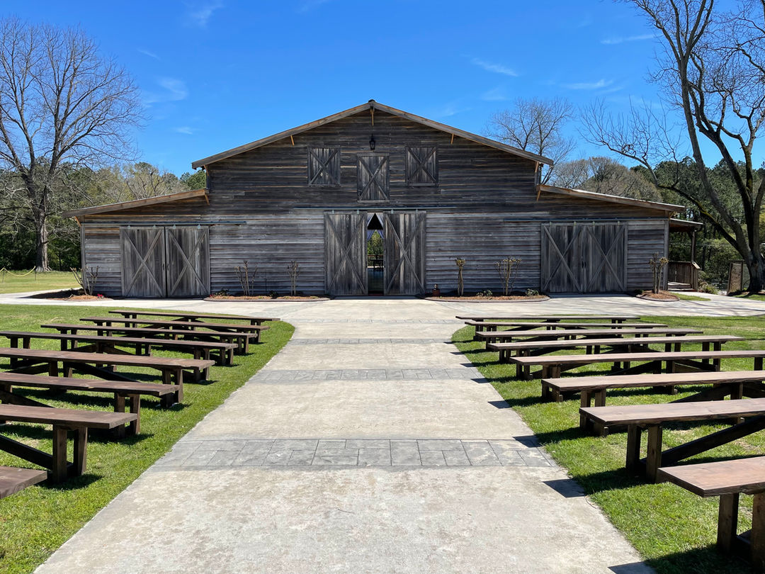 The Wedding Barn at L'Horne venue in middle Georgia featuring our walkway with pews for seating