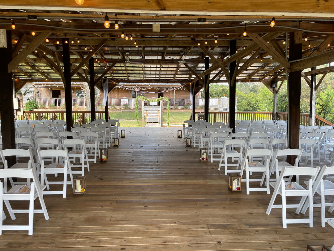 The Wedding Barn at L'Horne venue in middle georgia featuring our pole barn ceremony site facing the grand barn