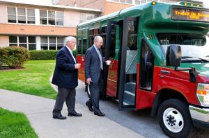 Mayors Rogers Anderson of Williamson County (l) and Ken Moore of Franklin (r) board a FTA bus.