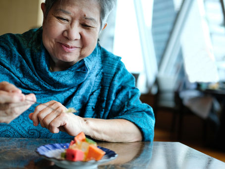 Older Asian Woman Eating Fibrous Fruits