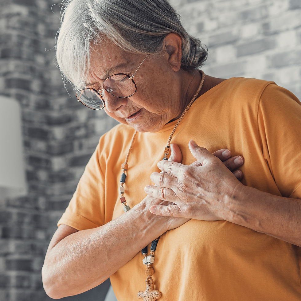 senior woman experiencing chest pain