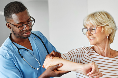 elderly woman getting examined by a doctor