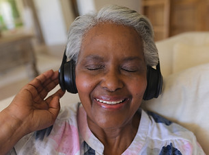 senior-woman-enjoying-music-with-headphones-indoor-2026-03-25-01-29-09-utc.jpg