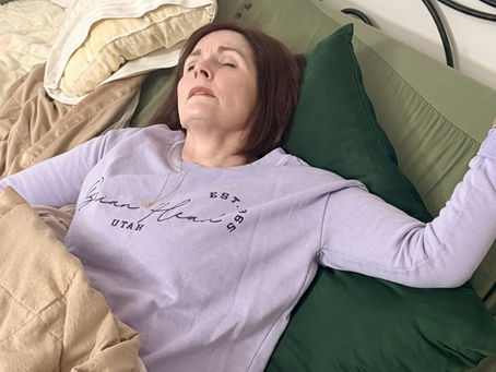 Leslee laying in bed after getting tired