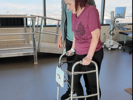 leslee in specialized PT working with a walker