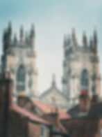 York Minster towering over red brick buildings.