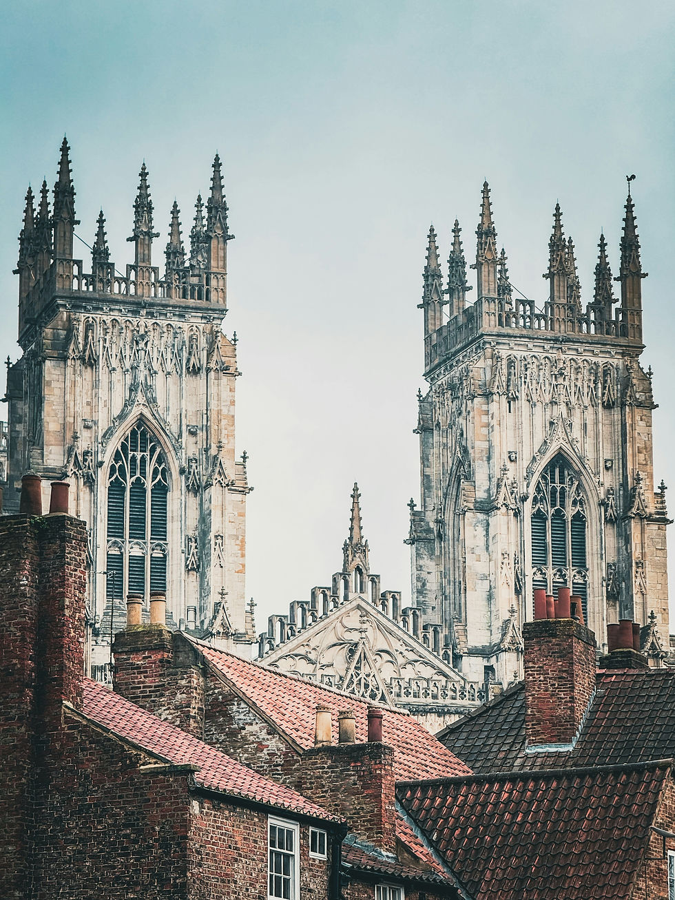 York Minster towering over red brick buildings.