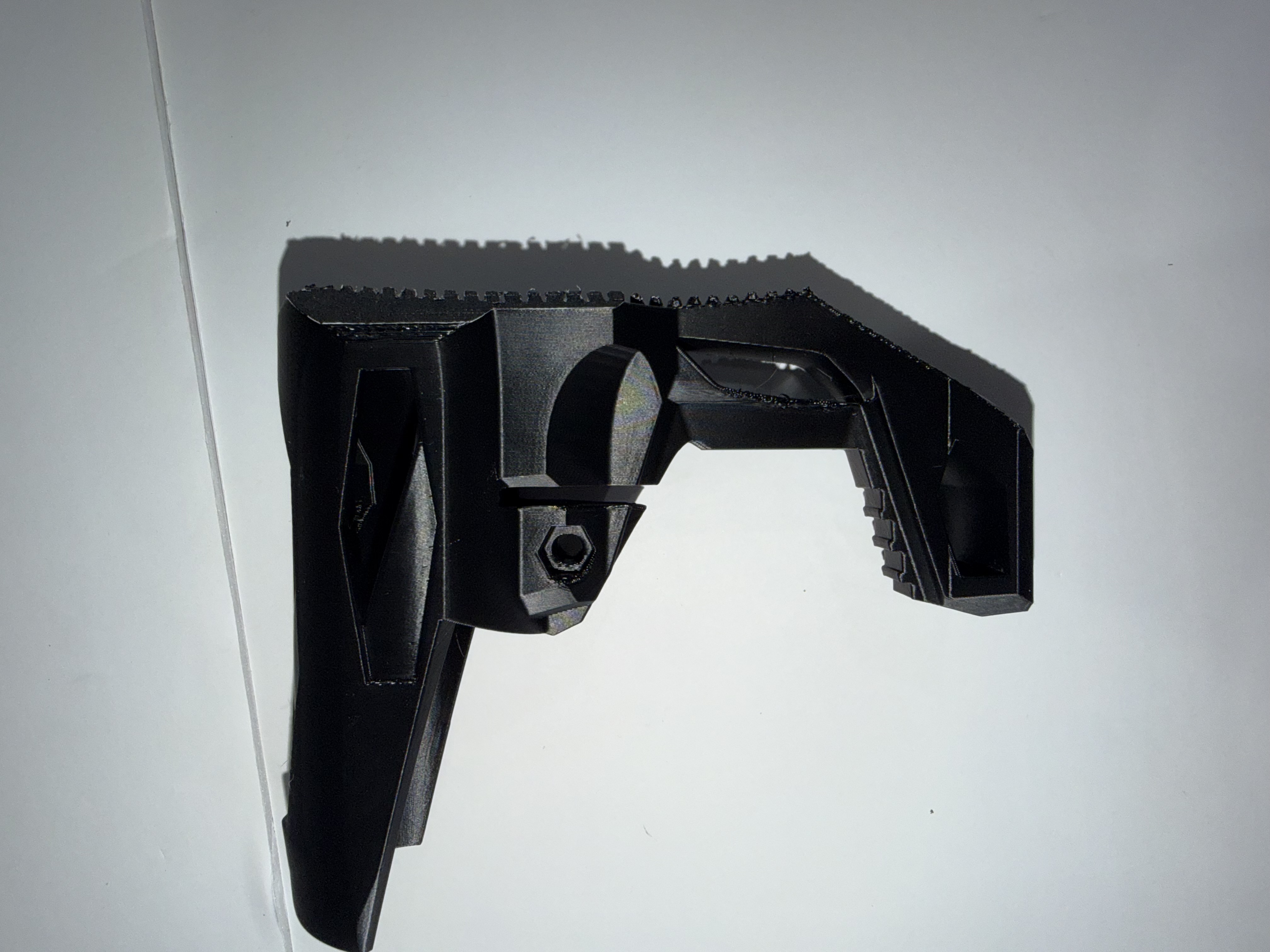A custom 3D printed launcher modification with a sleek matte black finish.