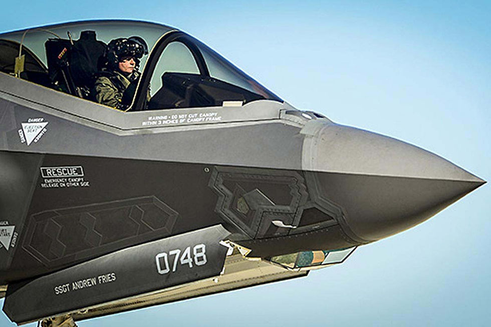 A U.S. Air Force pilot waits in the cockpit of an F-35 Lightning II during a hot refuel at Eglin Air Force Base, Fla., on Dec. 12, 2013. (Senior Airman Christopher Callaway/Air Force)