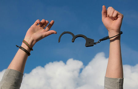 A person breaking free from their past because they were able to expunge their criminal history.
