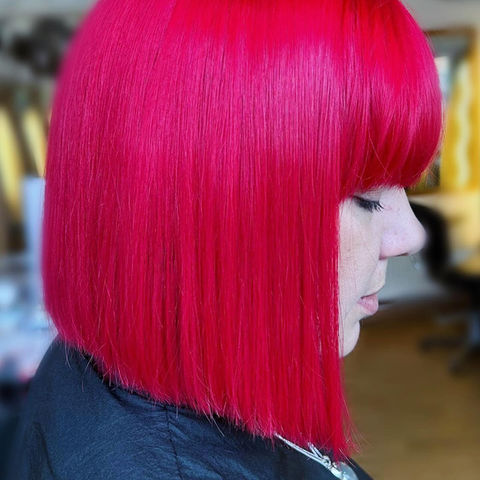 Lady with short, red hair in the hairdressers