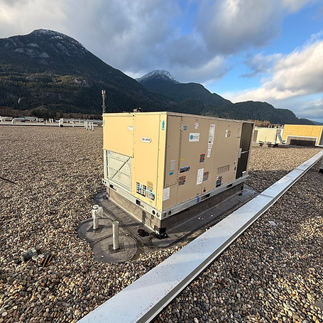 Commercial rooftop HVAC unit installed by Headwind, with mountains in the background