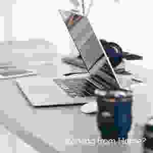 Laptop sitting on desk. Business owner working from home.