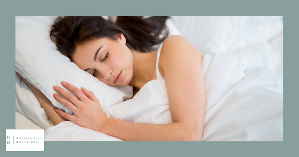 Woman sleeping in a bed with white sheets