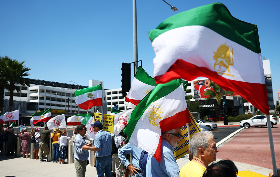 Iranian Americans wave protest flags as Iran play World Cup opener