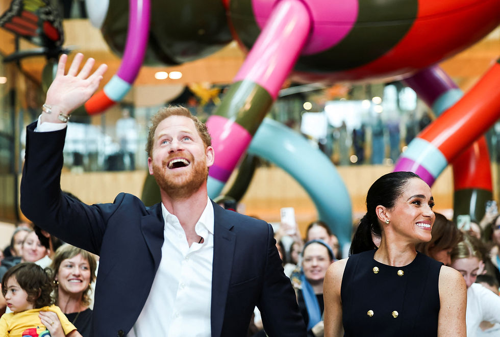 Prince Harry and Meghan arrive in Australia to a muted welcome
