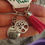 Thumbnail: Positive change zipper charms with tree of life charm attached 